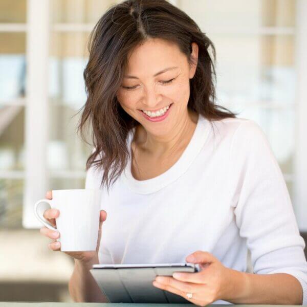 Woman enjoying a cup of coffee in the morning.
